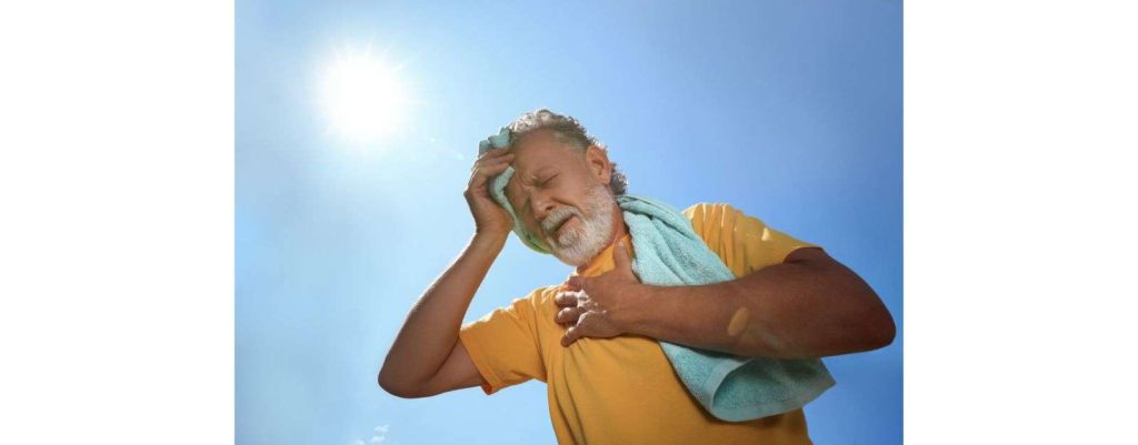 uomo in sofferenza con problemi di cuore dovuti al caldo